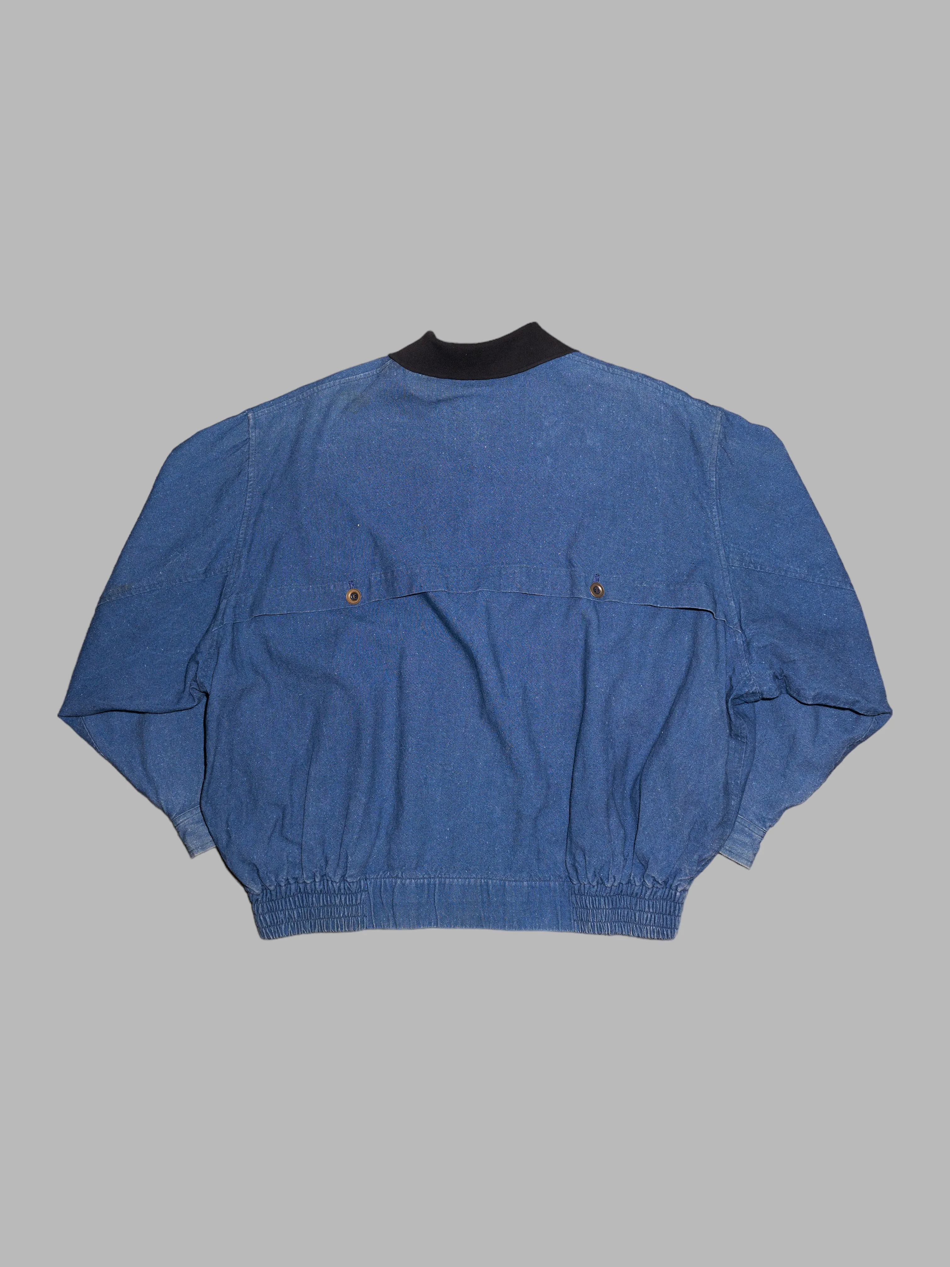 Person's 1980s indigo denim flannel lined bomber jacket
